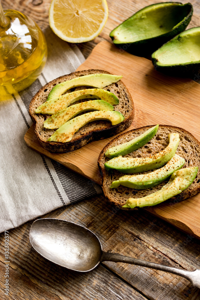 making sandwiches with avocado healthy organic food top view