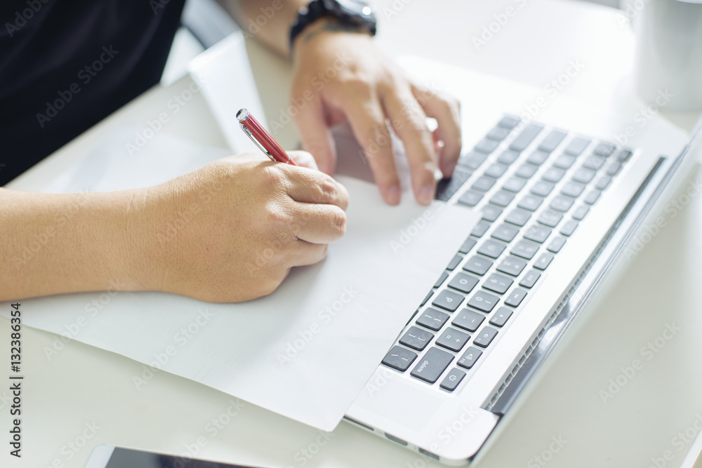 Businessman holding a pen for working on his plan project