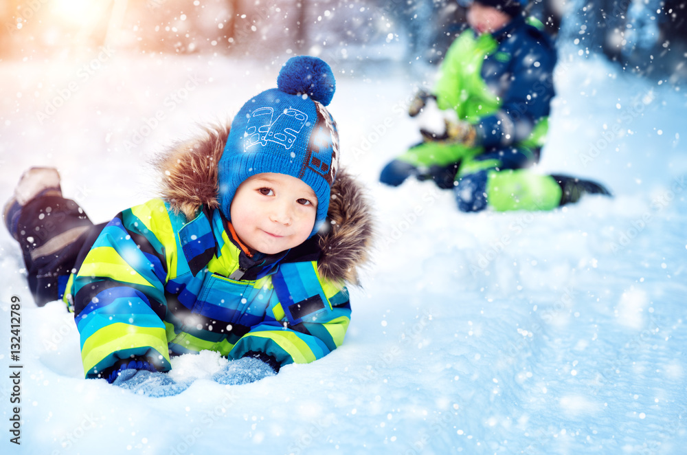 Children playing in snow at snowfall