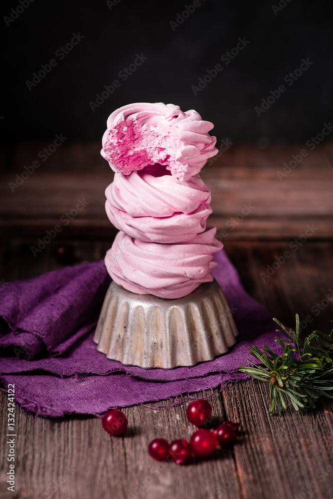 Russian marshmallows, zephyr with cranberries on wooden table. Cranberry. Still life.