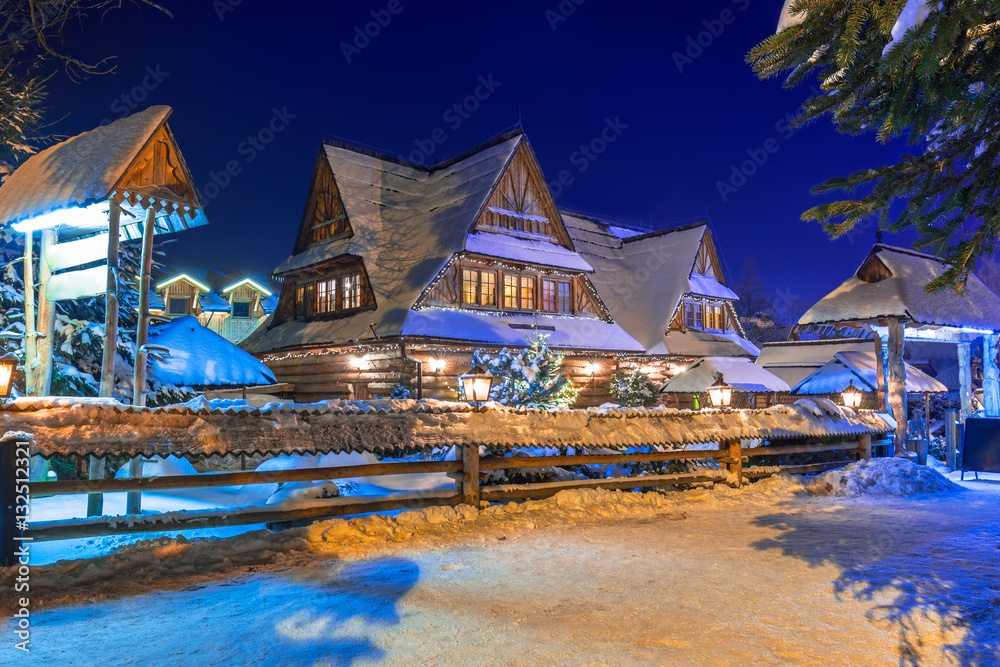 Wooden architecture of Zakopane at snowy night, Poland