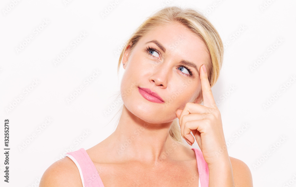 Young woman in a thoughtful pose