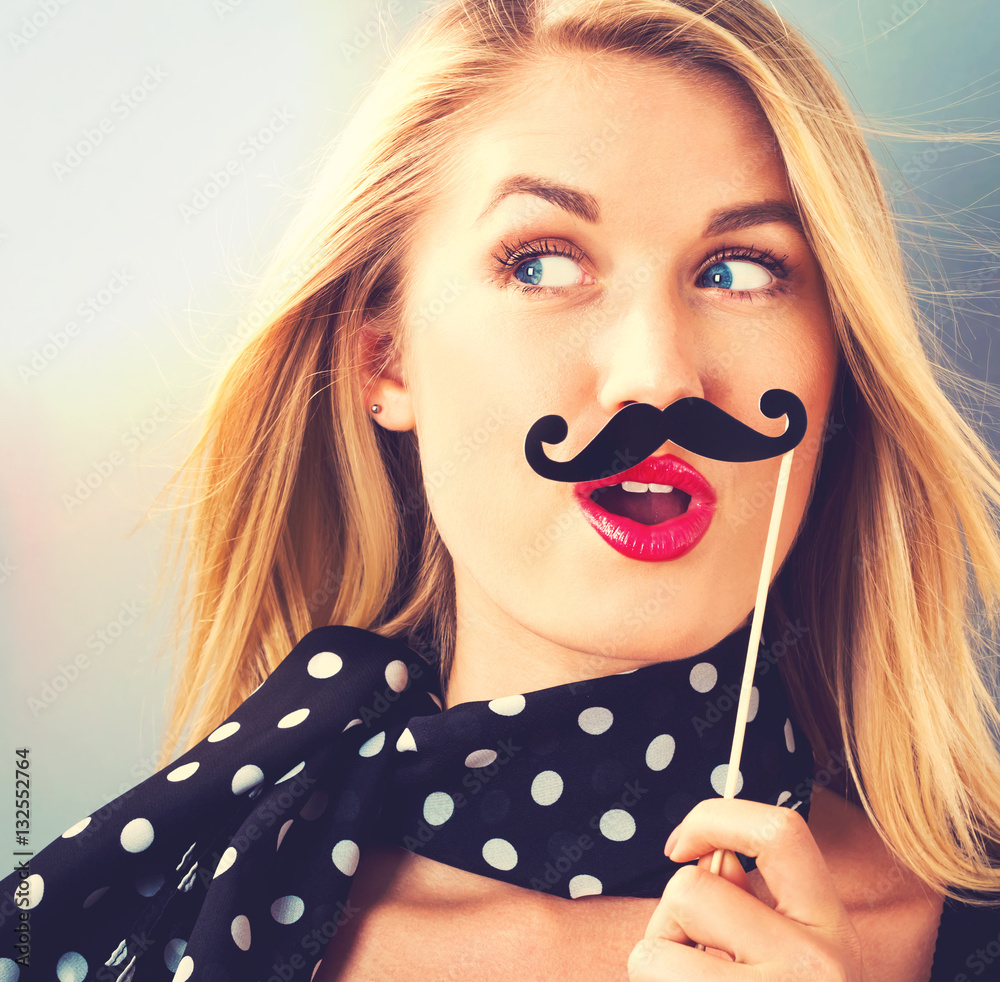 Young woman holding paper party sticks