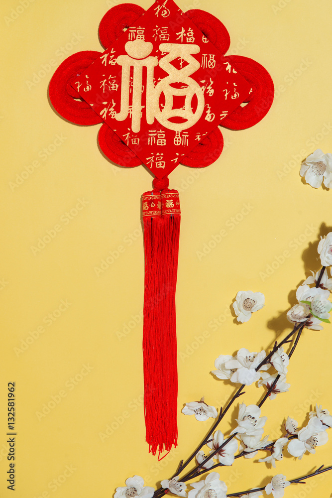 Chinese new year decoration items on yellow background.