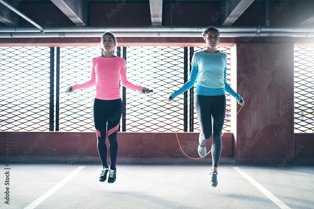 Young sporting women skipping