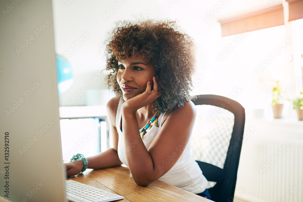 Young successful businesswoman browsing the net