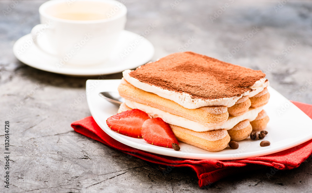 Tiramisu with strawberry on the table. Tea time