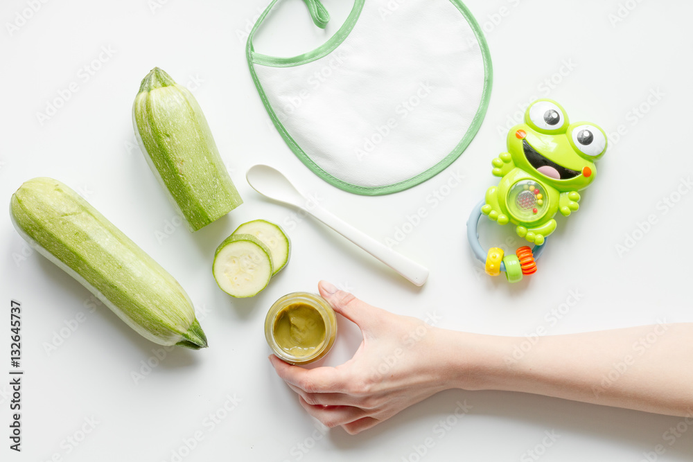 cooking vegetable puree for baby on white background top view