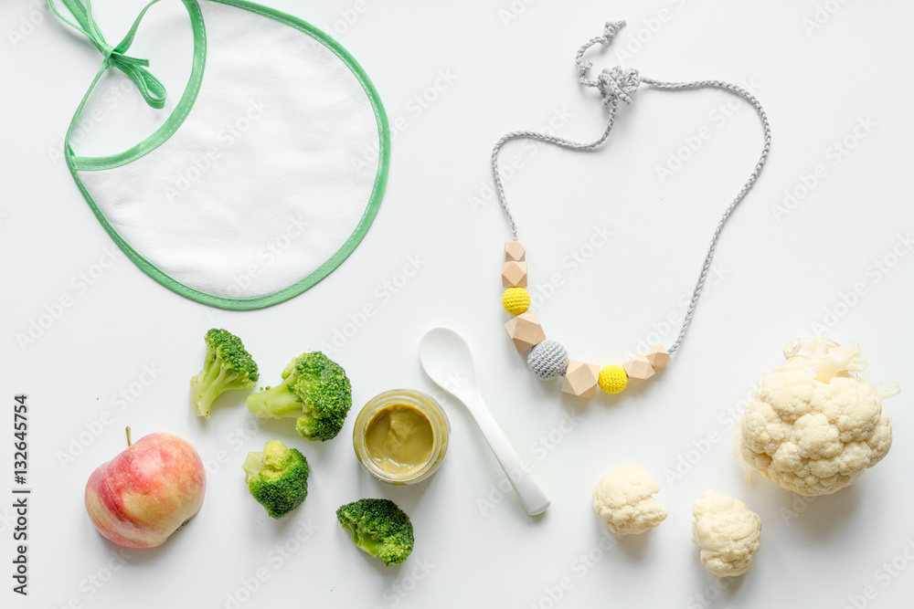 cooking vegetable puree for baby on white background top view