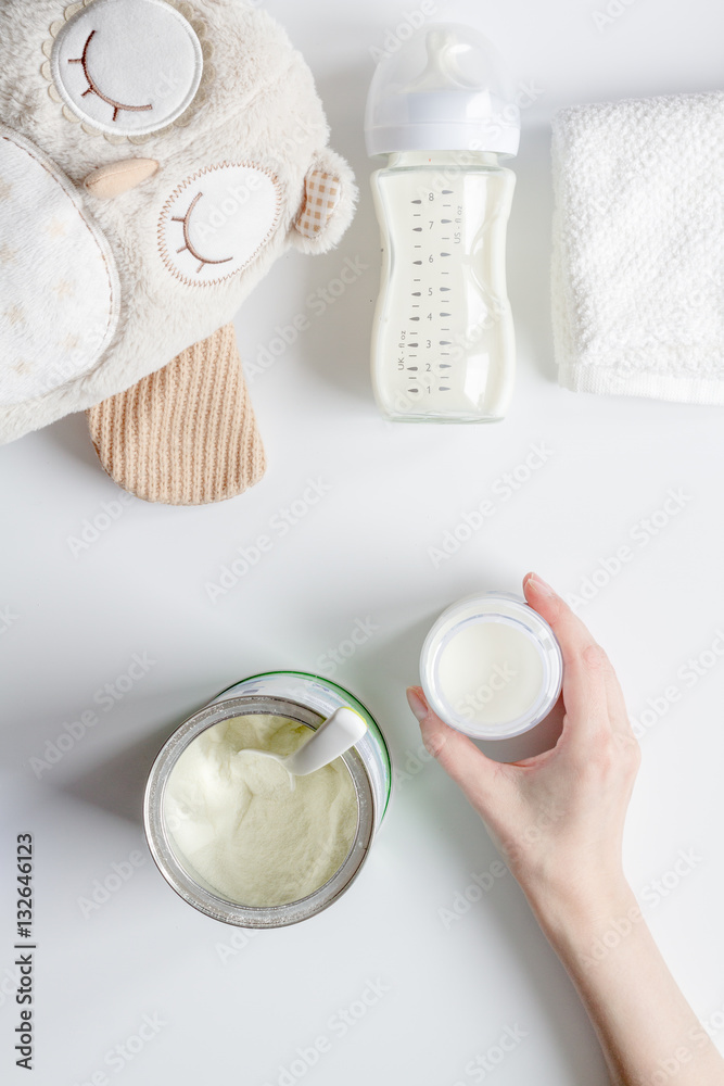 preparation of mixture baby feeding on white background top view