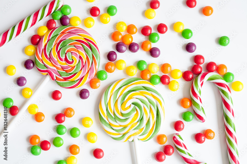 sweets and sugar candies on white background top view