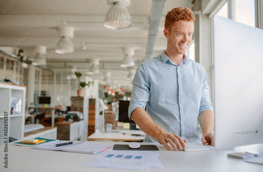 Young man working in modern office