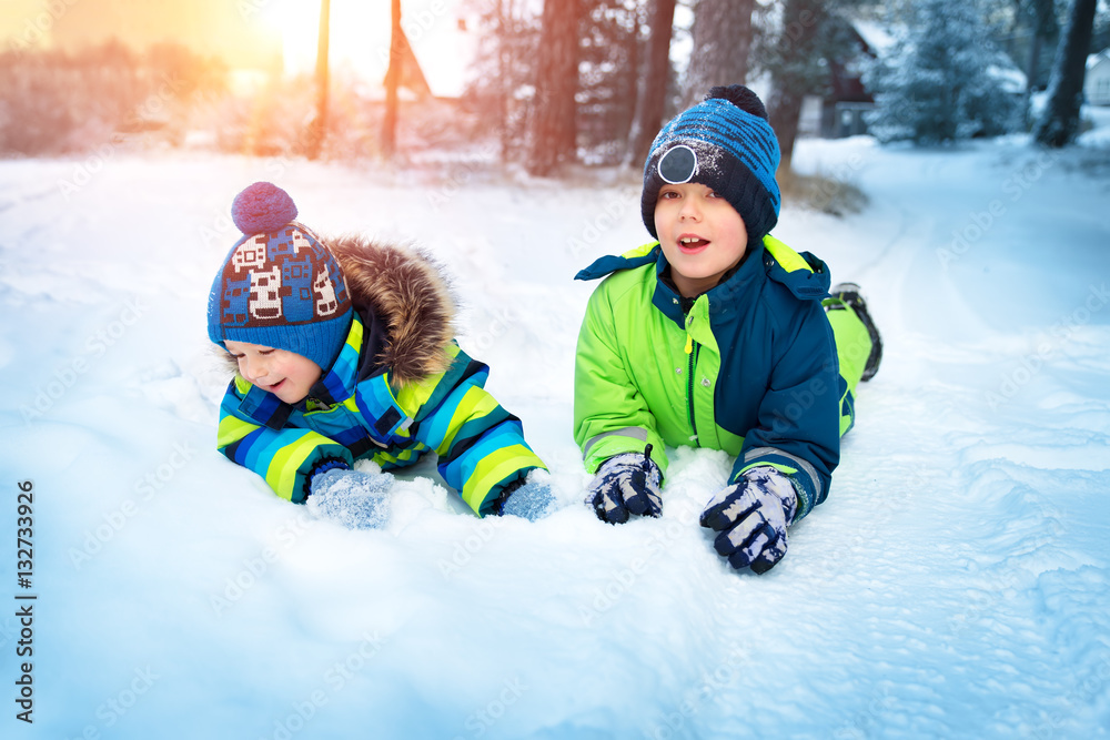 Children playing in snow at snowfall