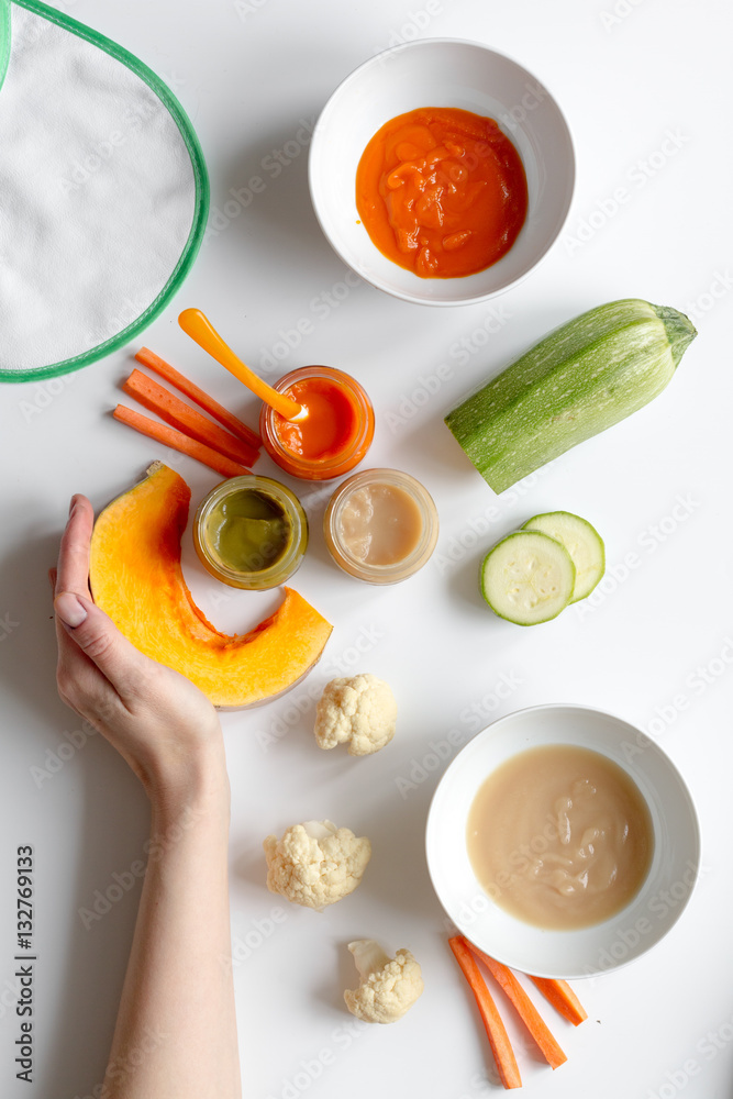 cooking vegetable puree for baby on white background top view