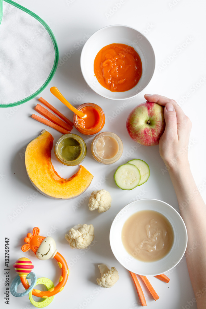 cooking vegetable puree for baby on white background top view