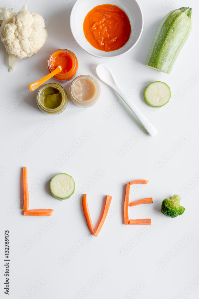 cooking vegetable puree for baby on white background top view