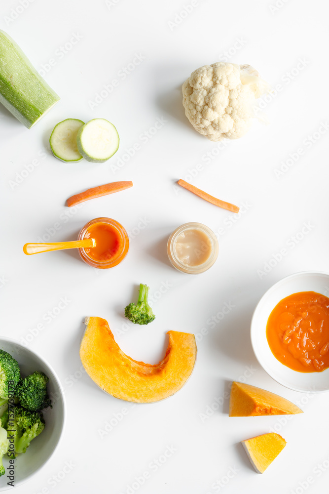 cooking vegetable puree for baby on white background top view