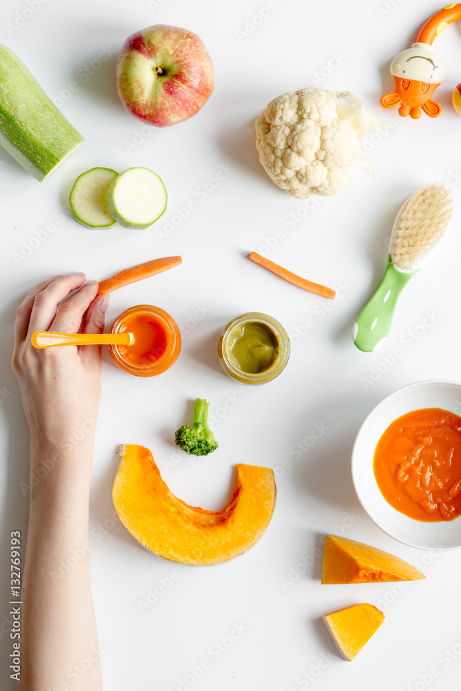 cooking vegetable puree for baby on white background top view