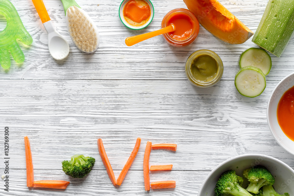 baby vegetable puree on wooden background top view