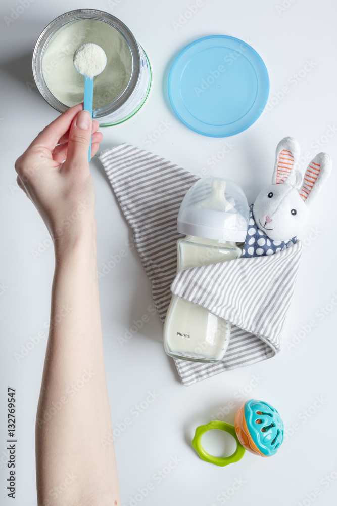 preparation of mixture baby feeding on white background top view