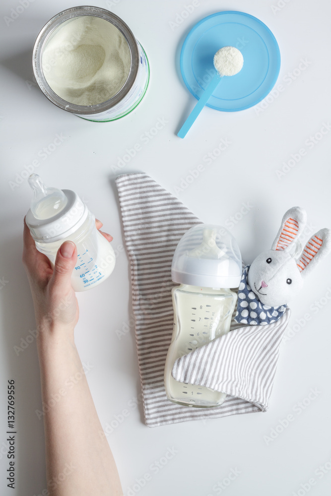 preparation of mixture baby feeding on white background top view