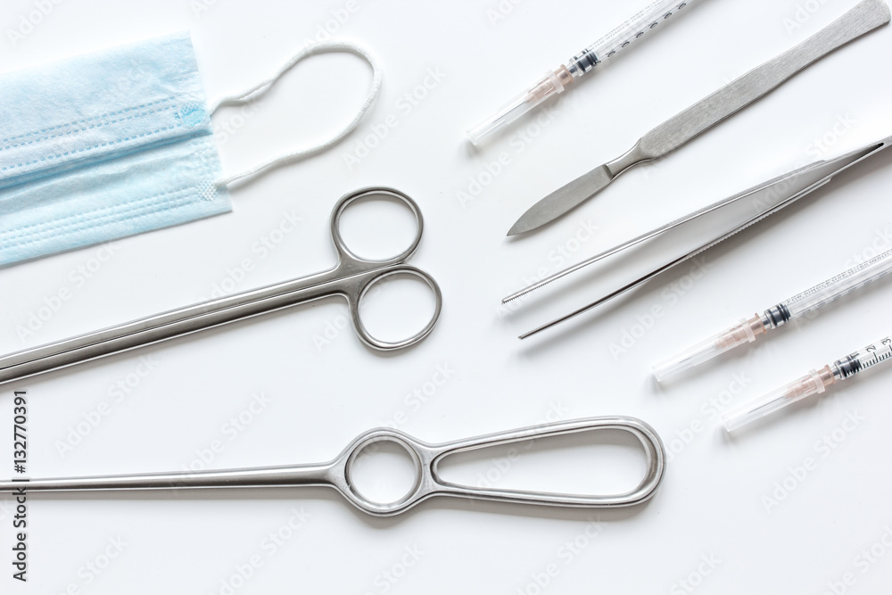 instruments for cosmetic surgery on white background top view