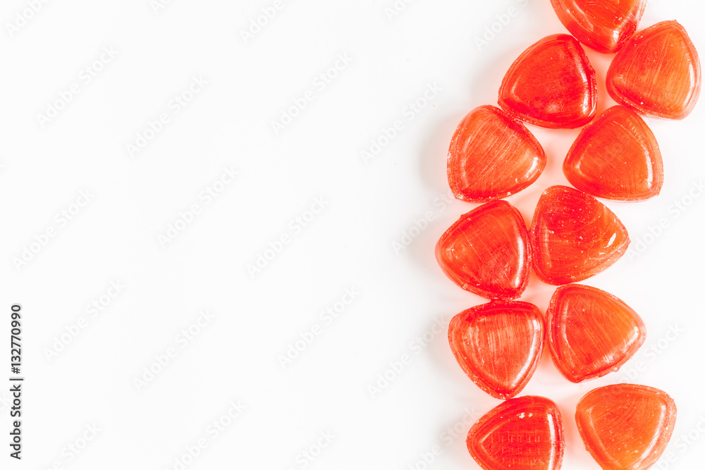 sweets and sugar candies on white background top view