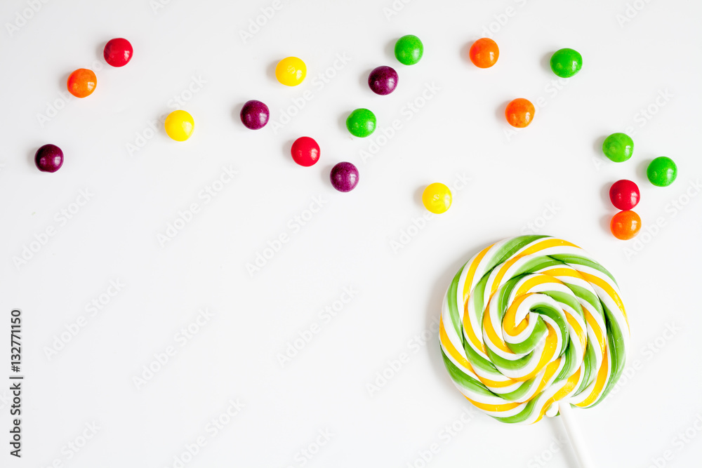 sweets and sugar candies on white background top view