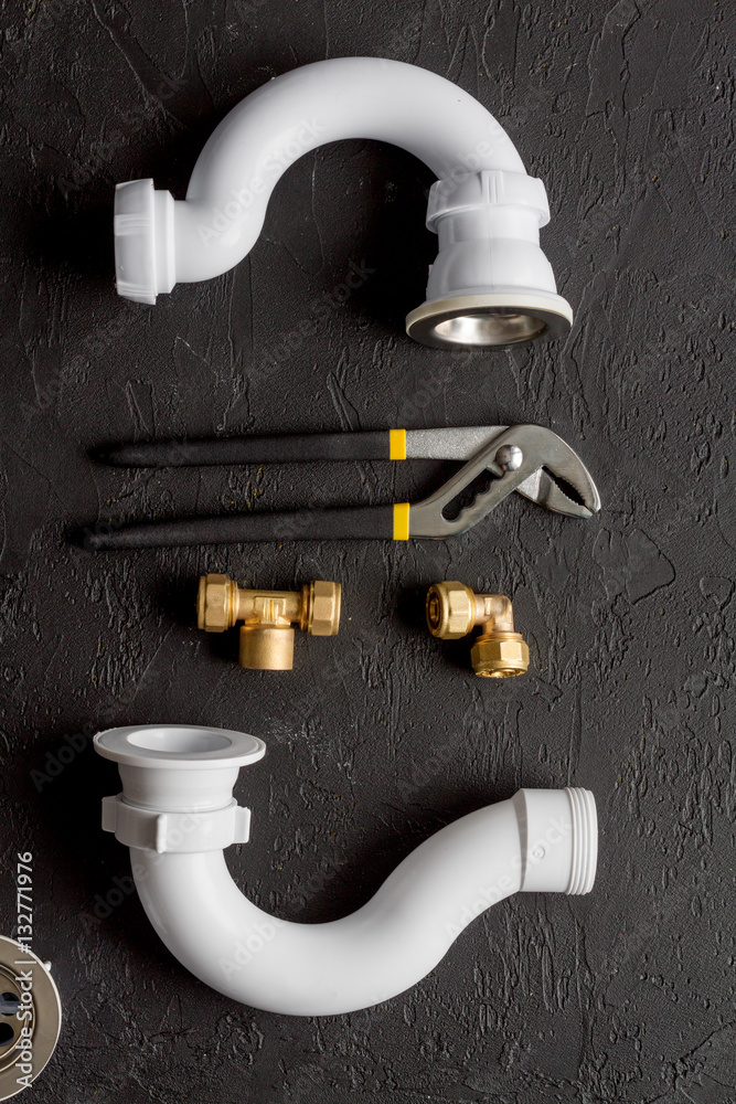 concept plumbing work top view on dark background