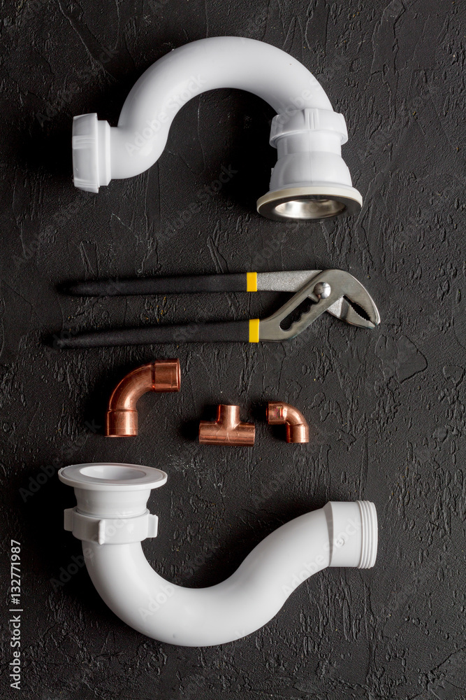 concept plumbing work top view on dark background