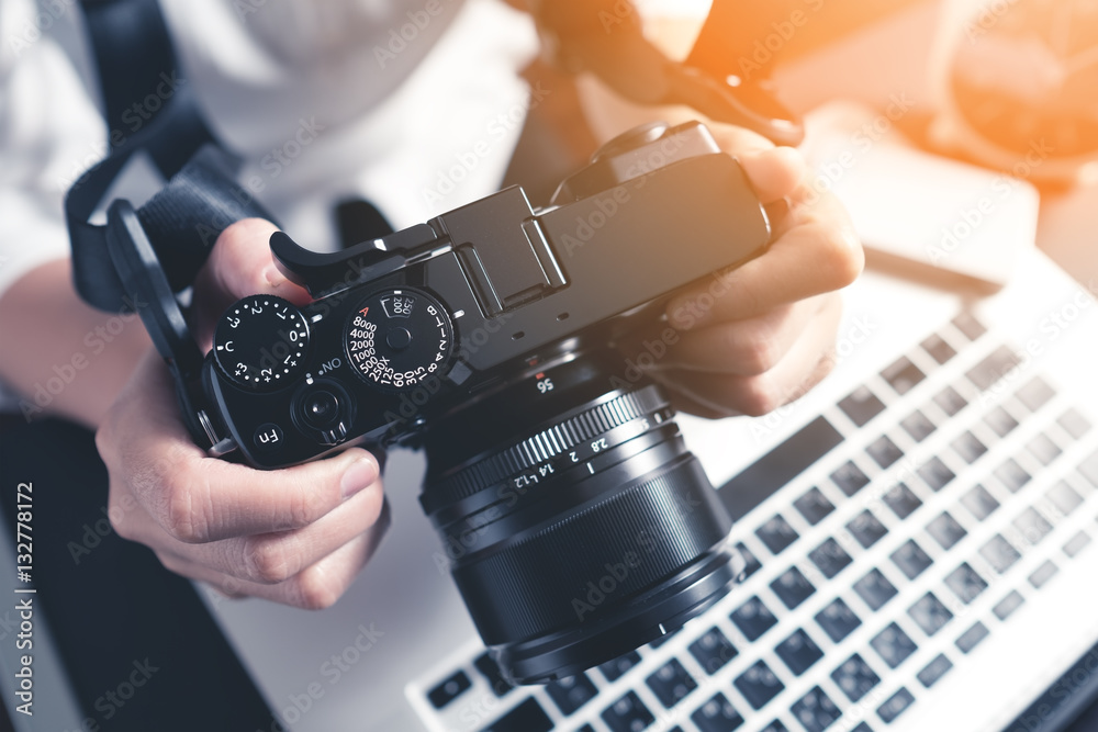 Photographer Workstation. Modern Digital DSLR Camera, Laptop and accessory.