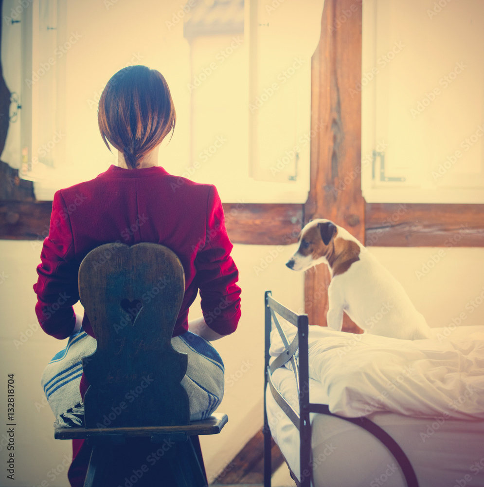  woman on chair and dog