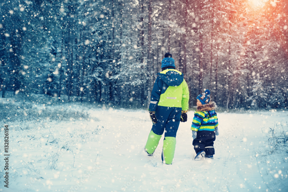 Children playing in snow at snowfall