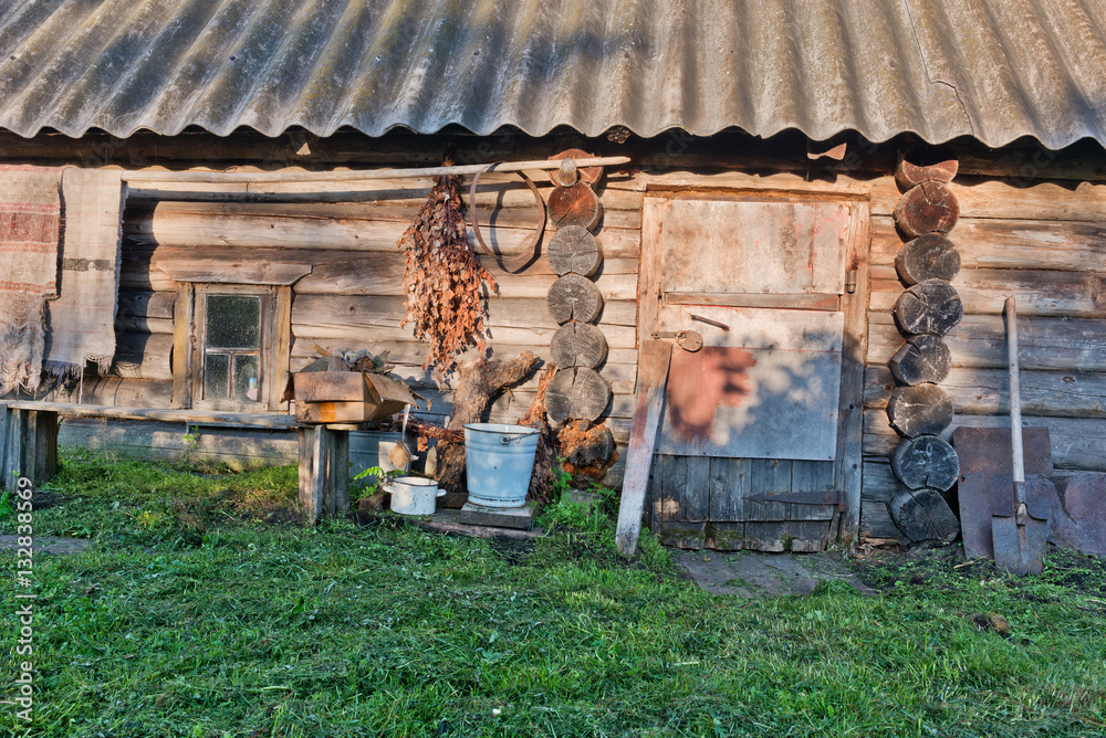 Old rustic bathhouse at sunset.