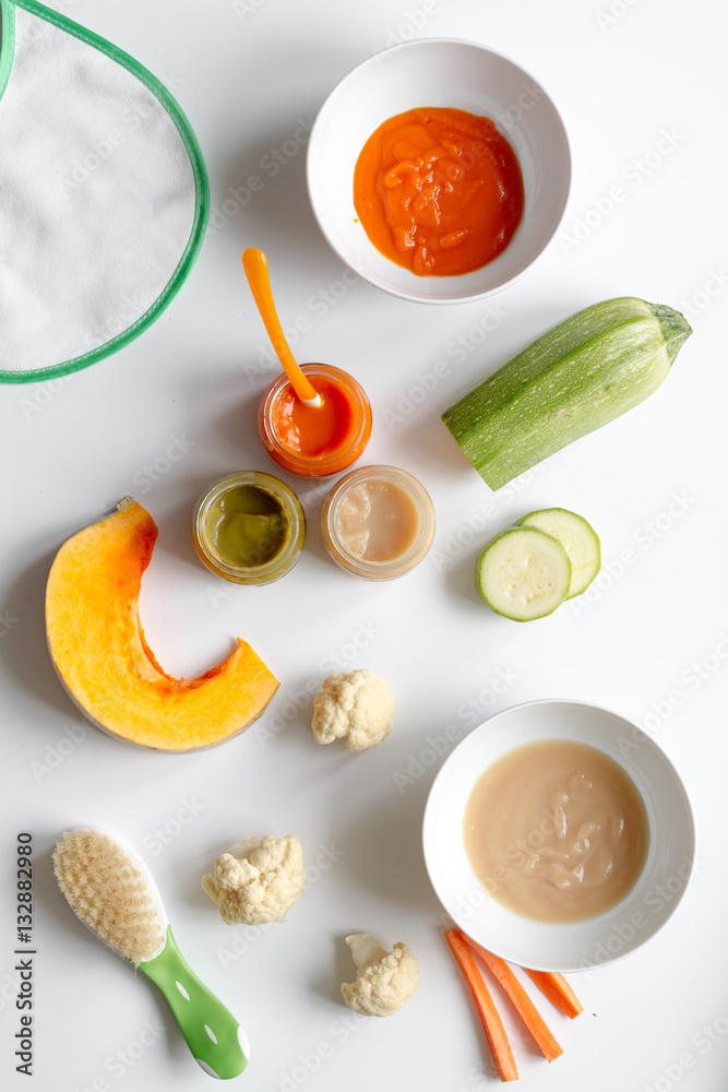 cooking vegetable puree for baby on white background top view