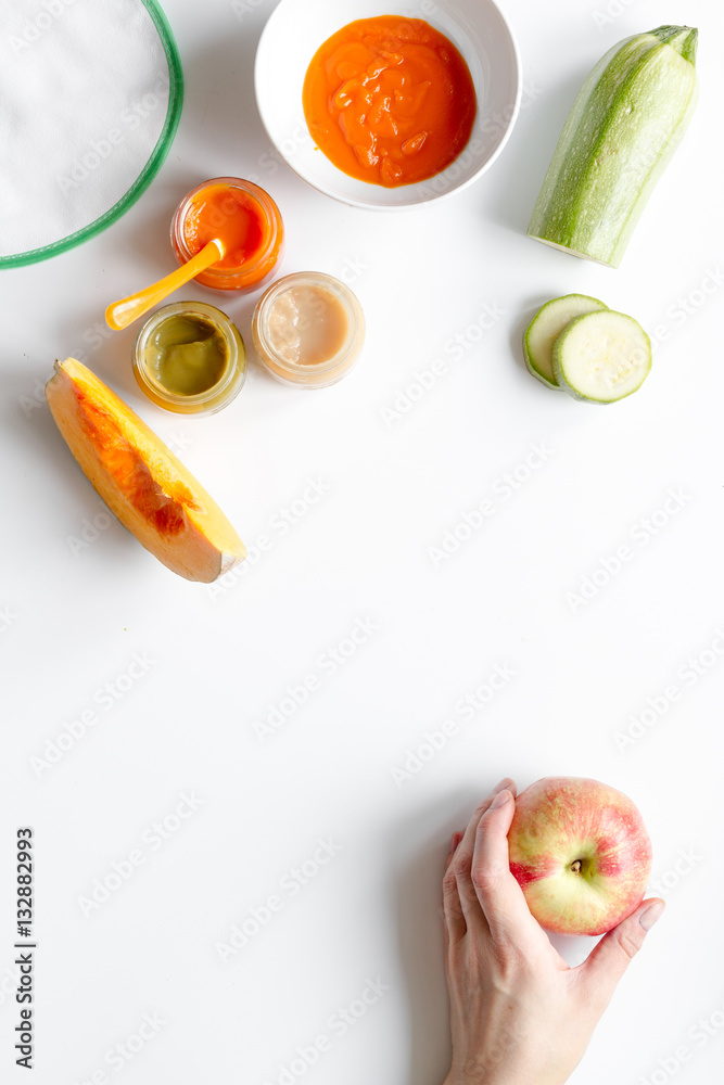 cooking vegetable puree for baby on white background top view