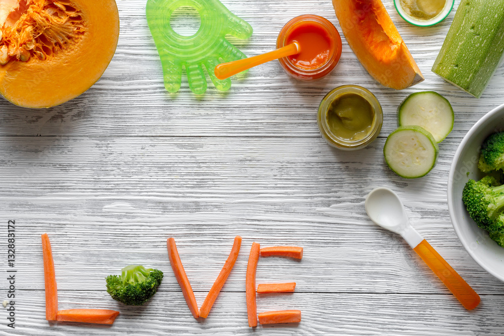 baby vegetable puree on wooden background top view