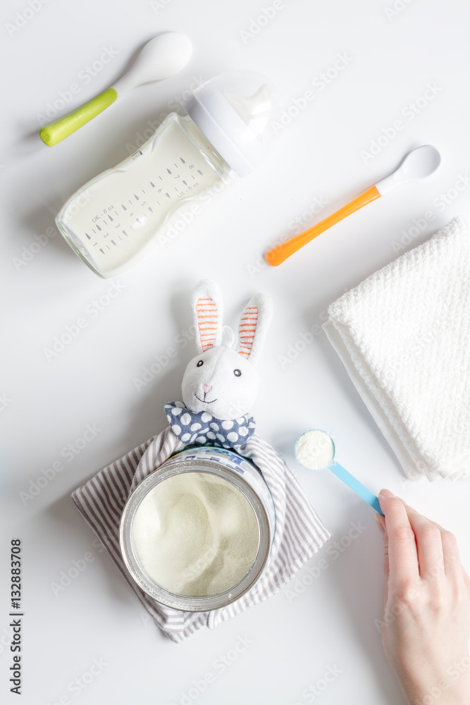 preparation of mixture baby feeding on white background top view