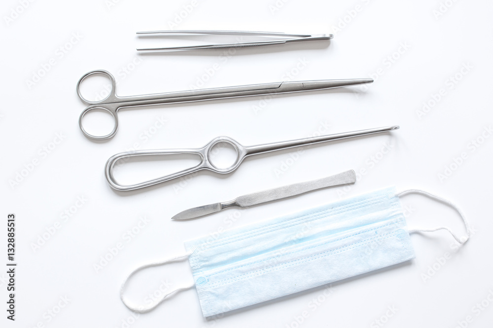 instruments for plastic surgery on white background top view