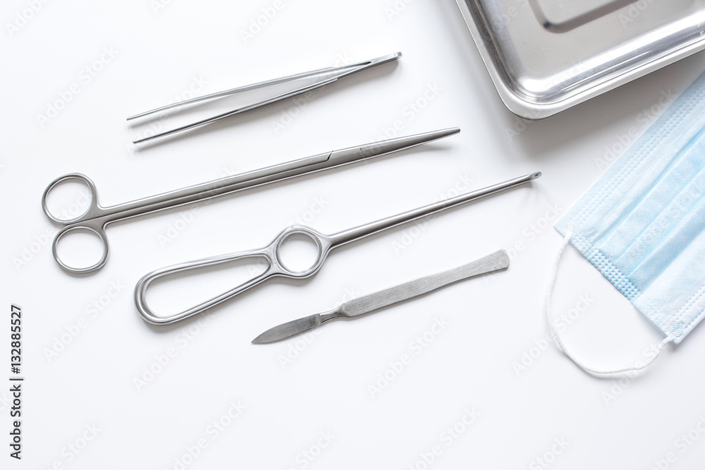 instruments for plastic surgery on white background top view