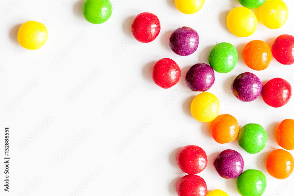 sweets and sugar candies on white background top view