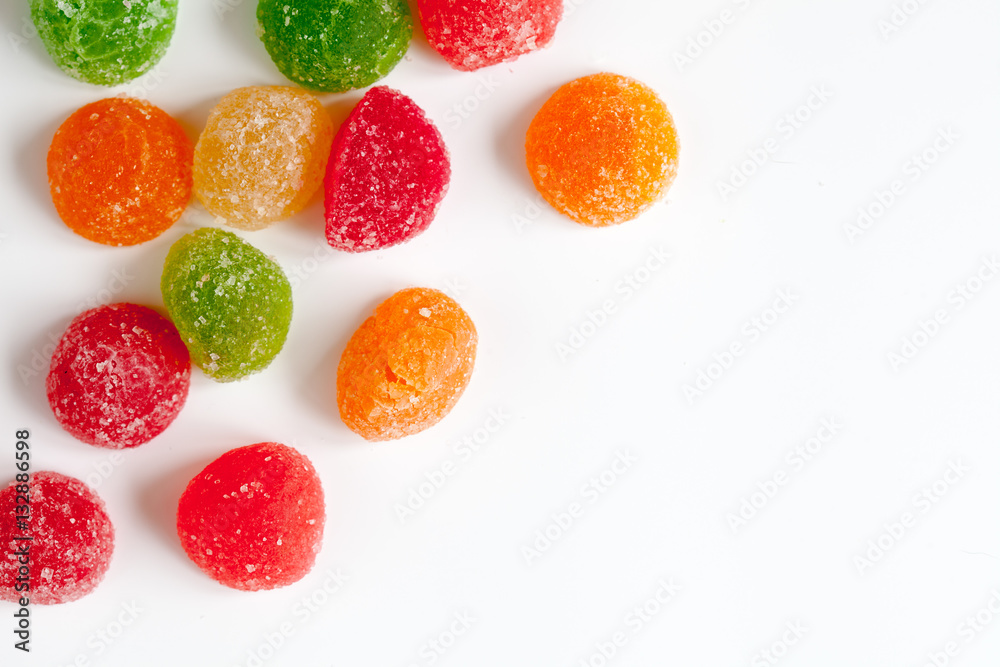 sweets and sugar candies on white background top view