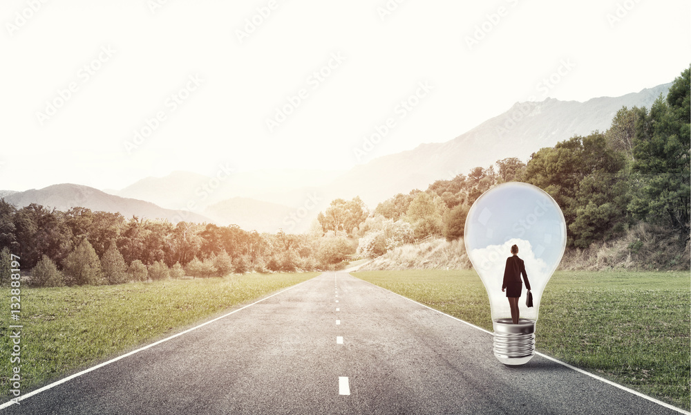 Businesswoman inside light bulb