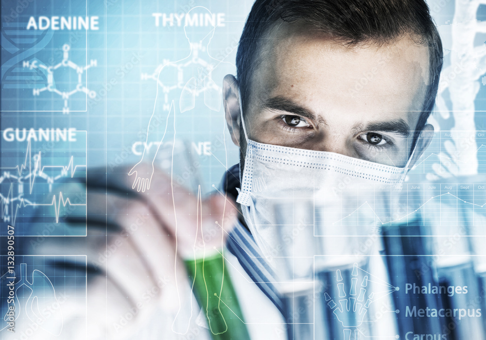 Portrait of concentrated male scientist working with reagents in laboratory