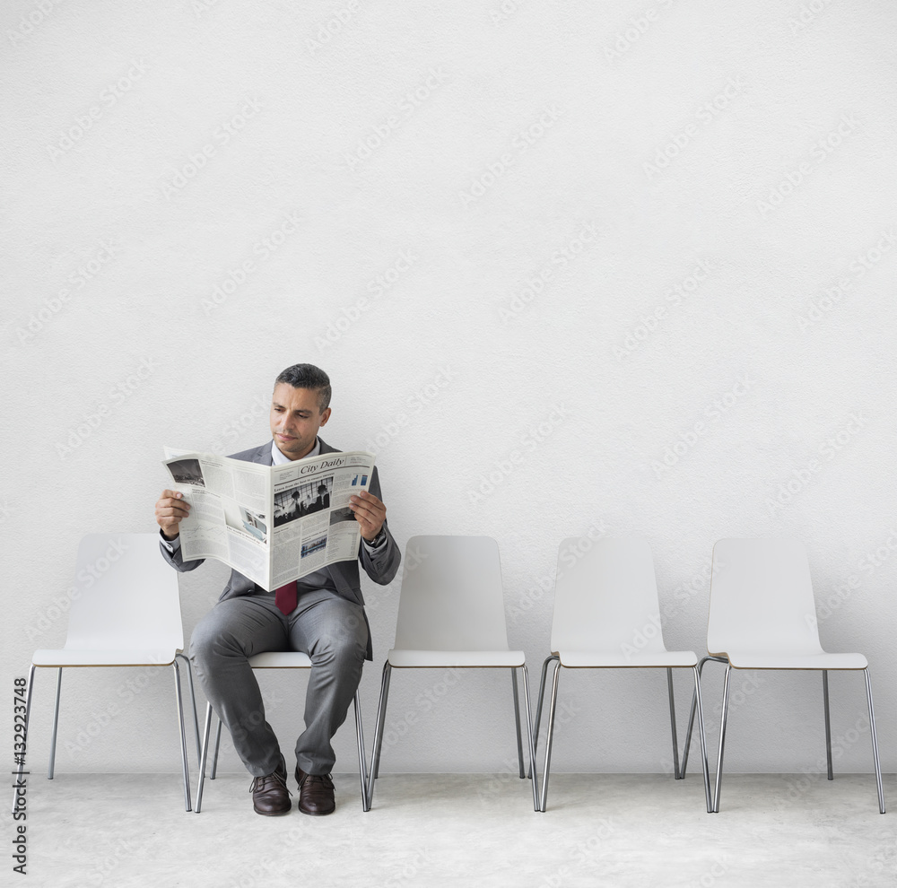 Businessman Reading Newspaper Workplace Concept