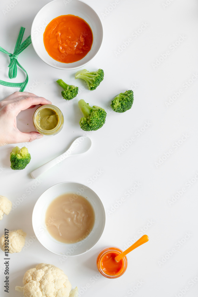 cooking vegetable puree for baby on white background top view