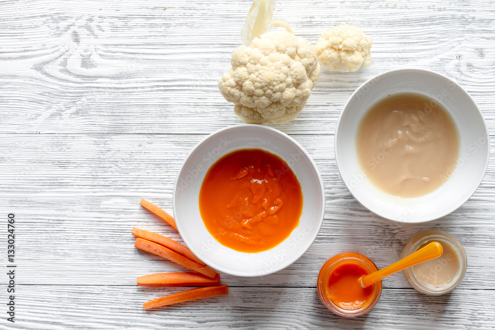 baby vegetable puree on wooden background top view