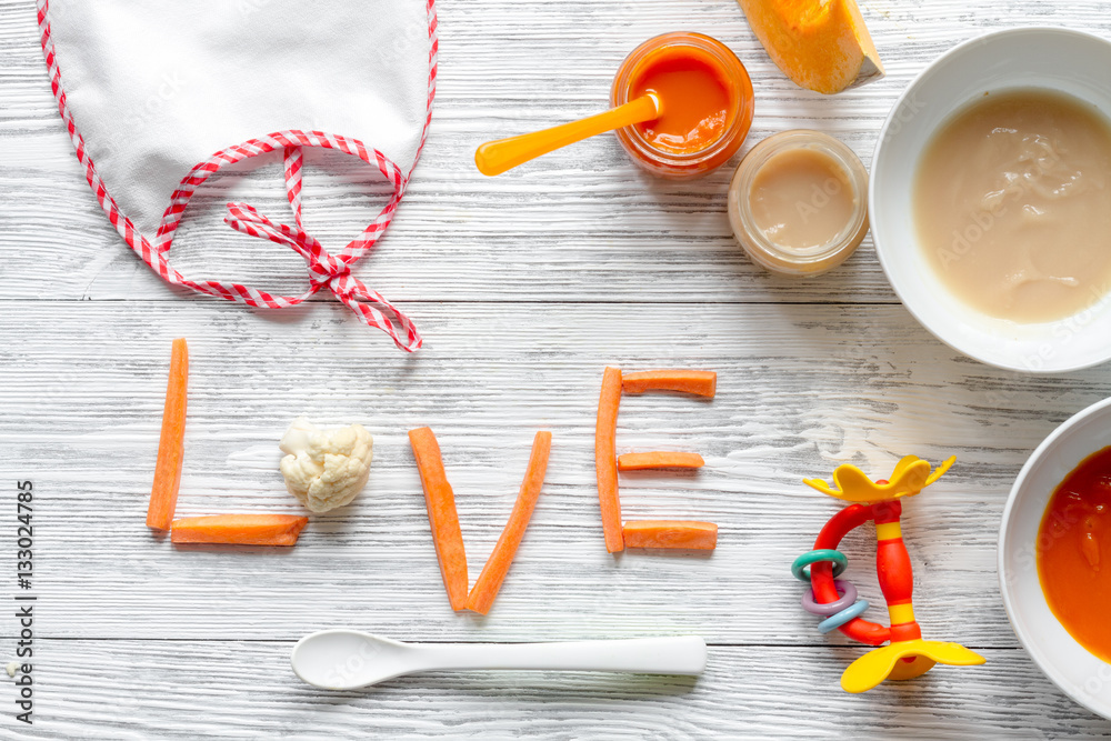 baby vegetable puree on wooden background top view