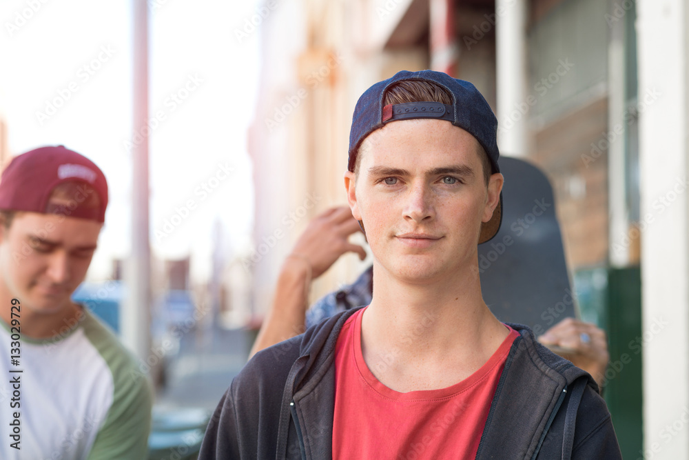 Guys skateboarders in street