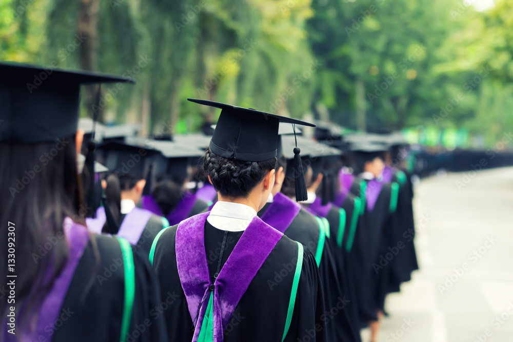 Back of graduates during commencement at university. Close up at